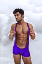 Purple holographic men’s jumpsuit for Burning Man and rave performers, showcasing a vibrant outfit perfect for festivals and pride events. Ideal for making a bold statement.