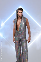 en’s holographic jumpsuit with hood up, ideal for Burning Man and festival performances, featuring a shimmering silver fabric with rainbow reflections.