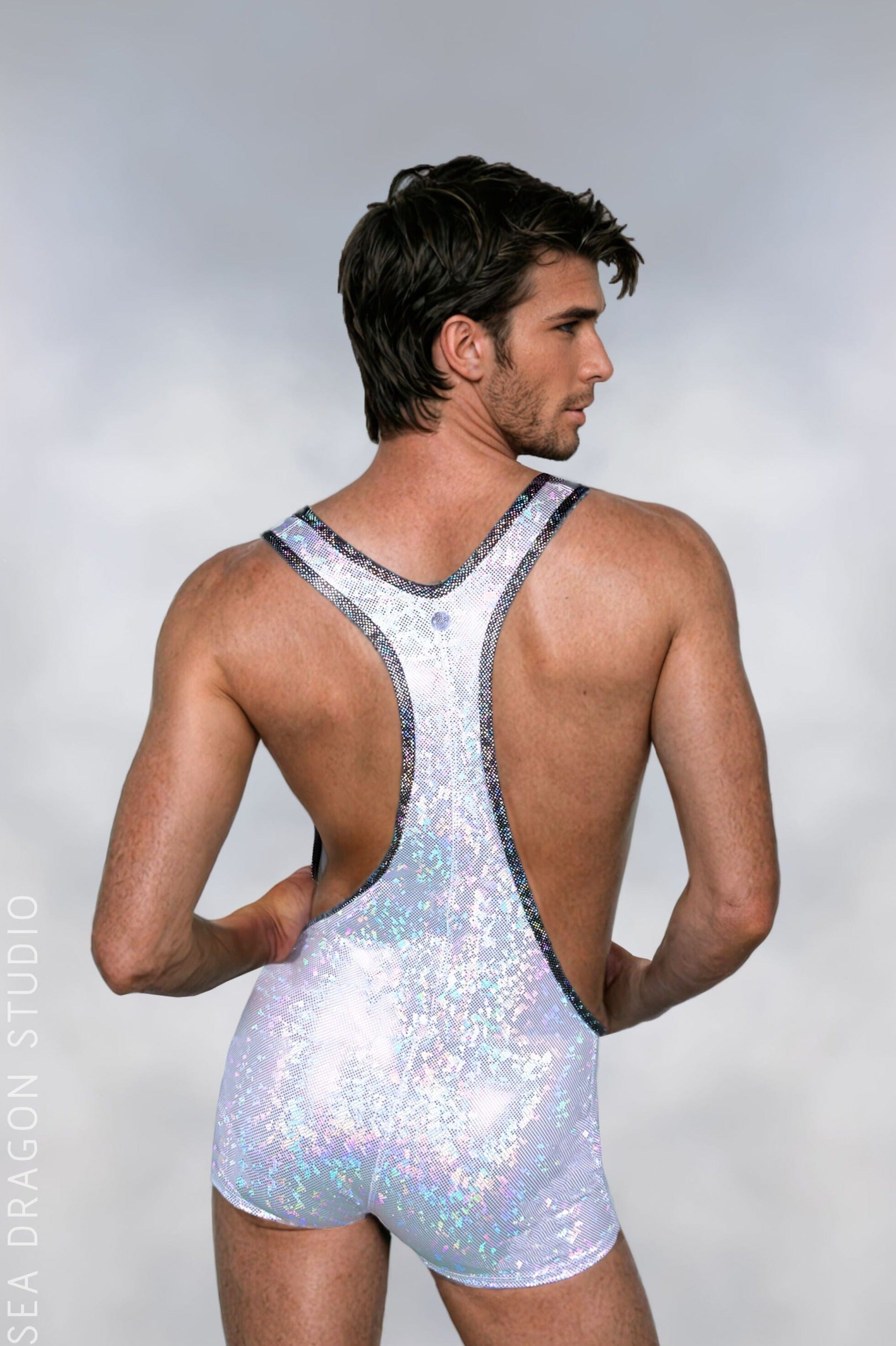 Shiny holographic men’s pride and rave outfit for Burning Man and festival wear, featuring a reflective singlet with racerback design, perfect for dazzling performances and high-energy events