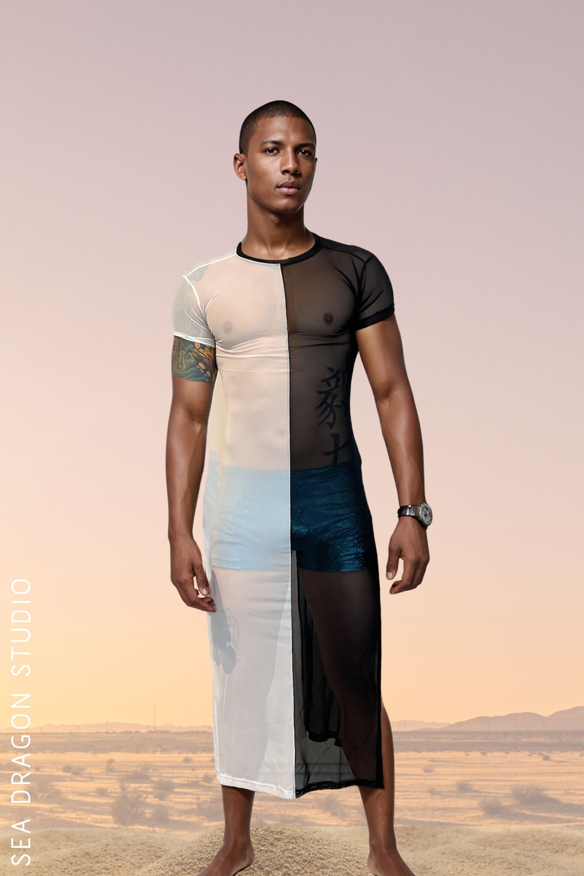 Model wearing the Duality Split Color Mesh Men’s Kaftan Dress from Sea Dragon Studio. Perfect festival clothing for men, featuring a unique black and white split design. Great for festival gear and fashion-forward events.